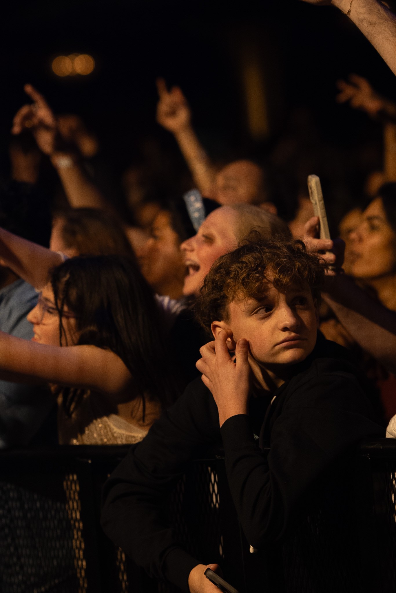 A young fan watches the Hanumankind set from the front row