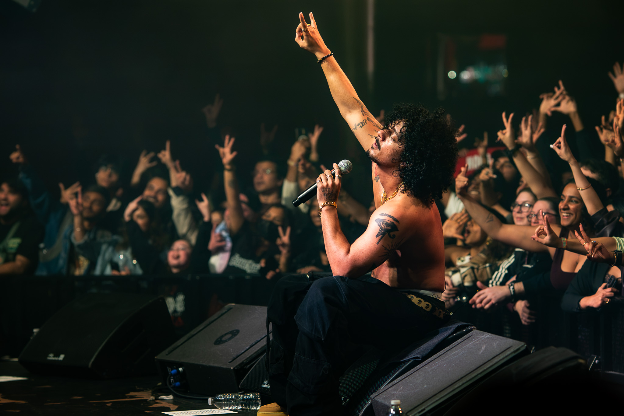 Hanumankind at the edge of the Showbox stage surrounded by the crowd