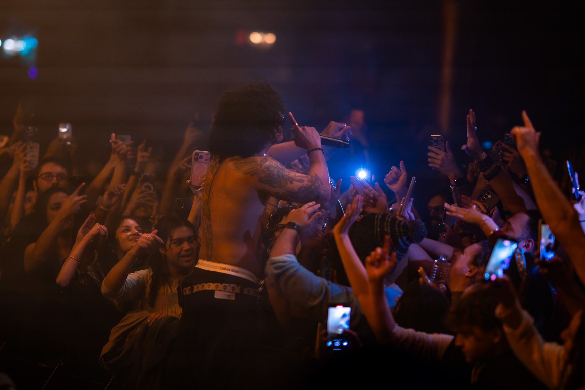 Hanumankind performs shirtless in the middle of a tightly packed crowd