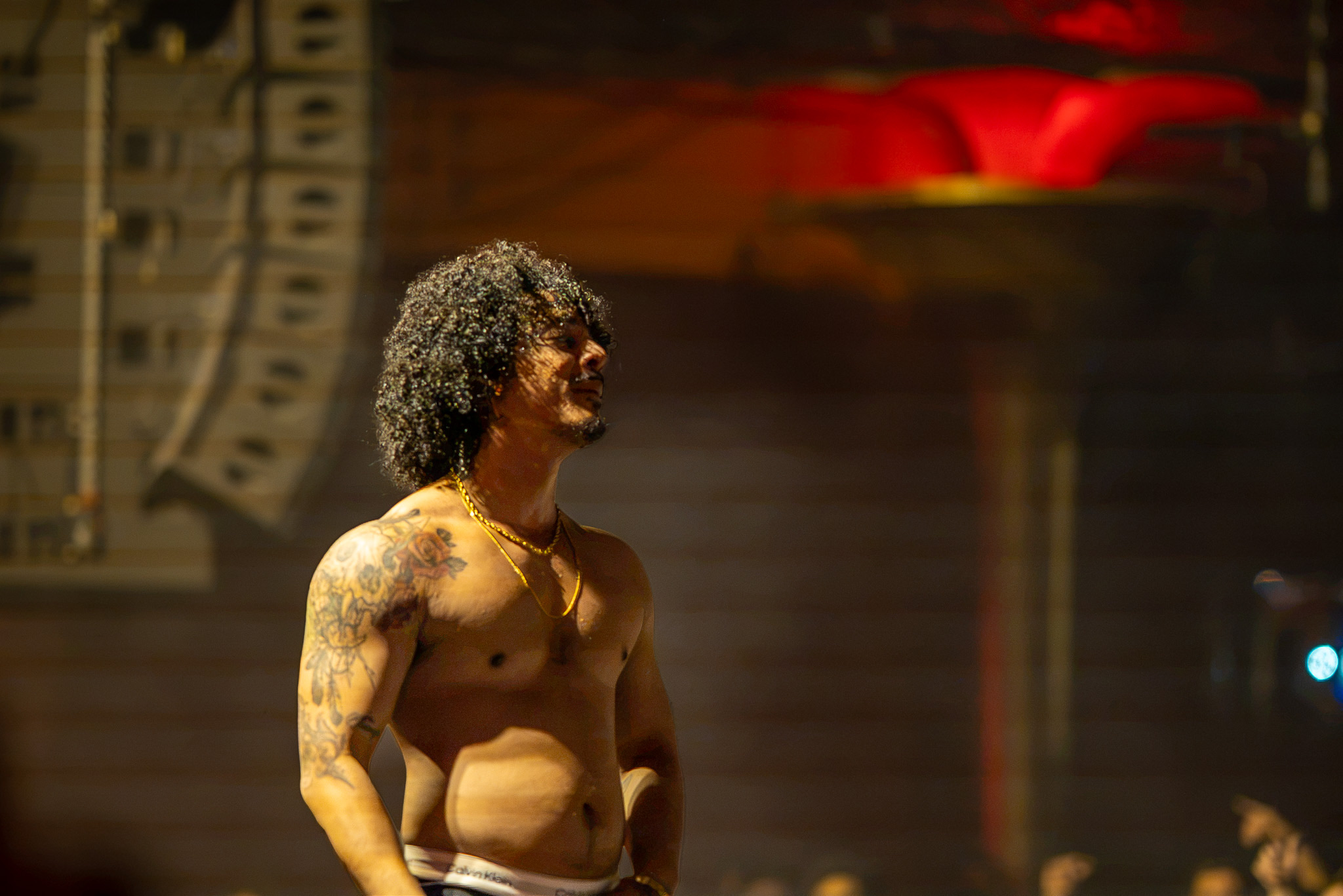 Hanumankind pauses under warm light near the end of the set