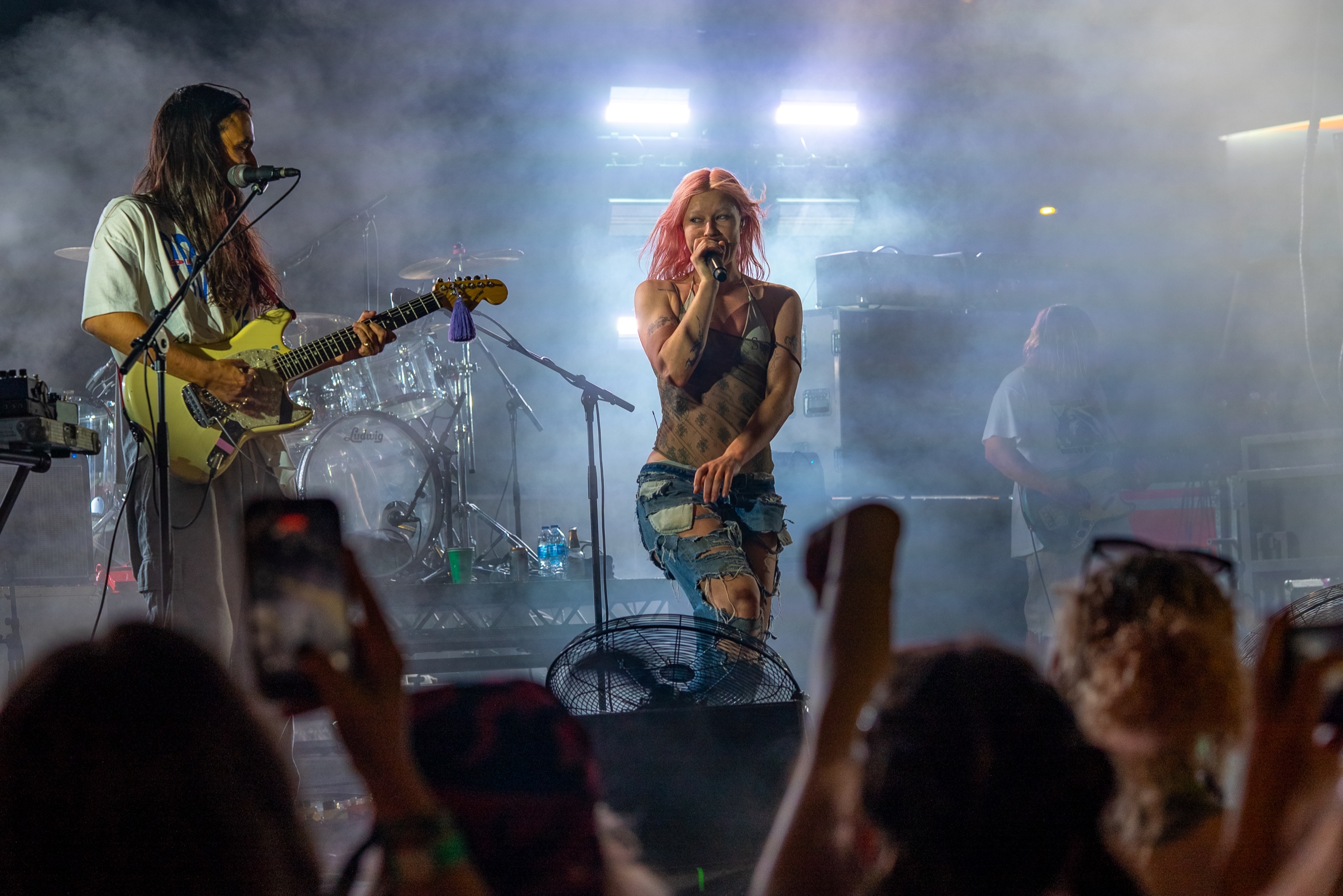 Wet Leg performing in smoke above raised phones and heads in the Capitol Hill Block Party crowd