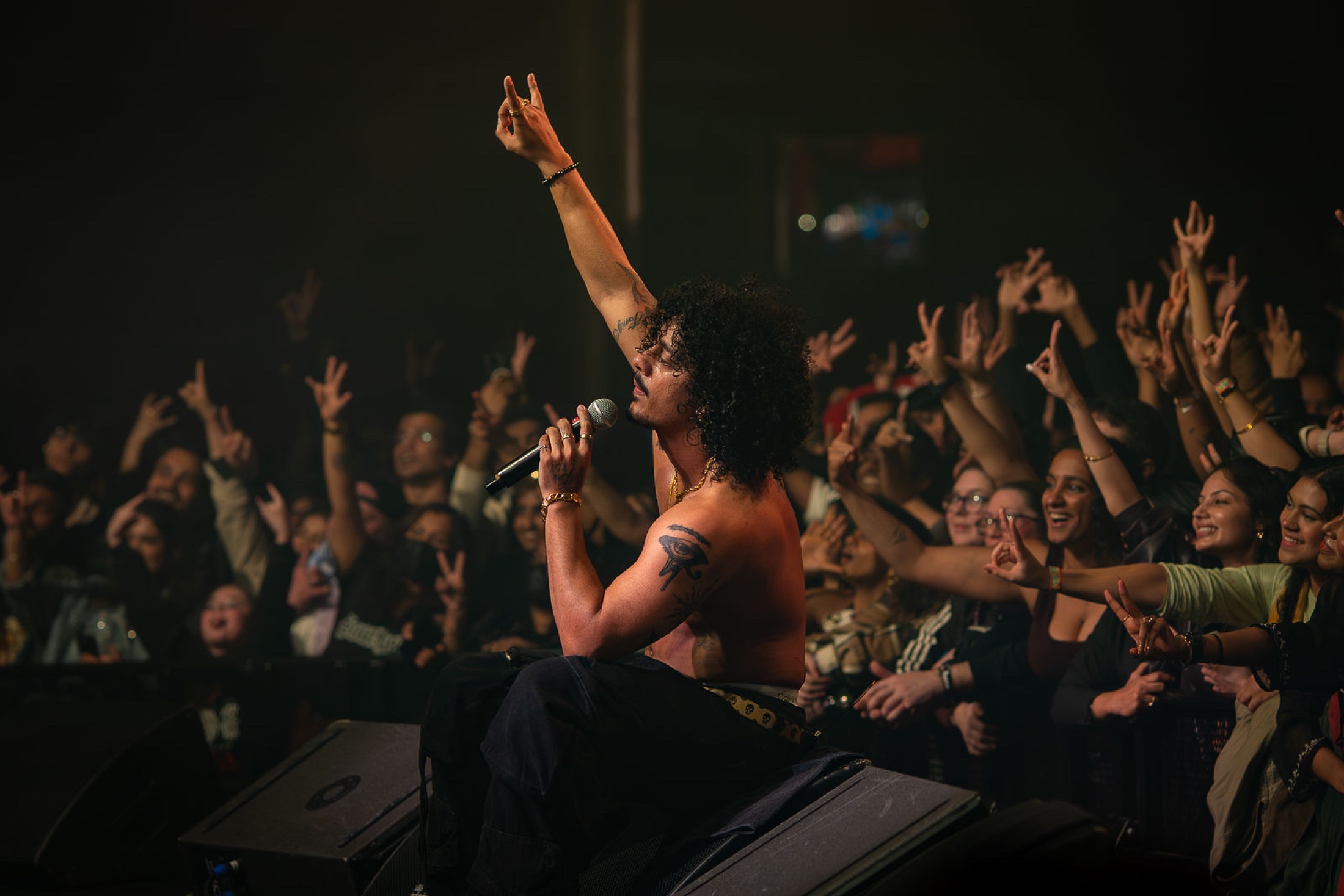 Concert artist performing at the edge of the crowd