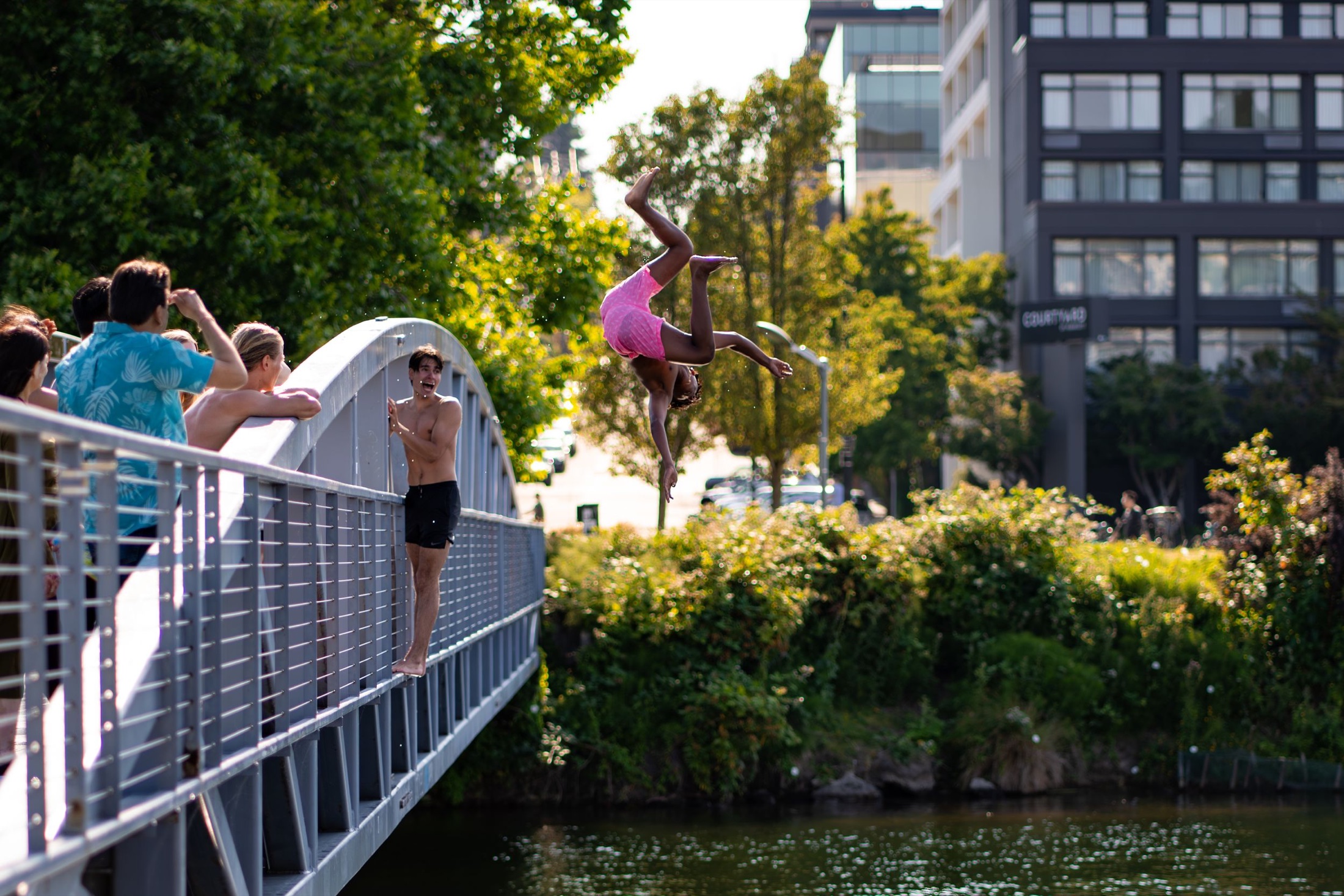 Dancer suspended over a bridge